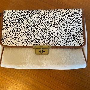 Cream and black Fossil clutch purse